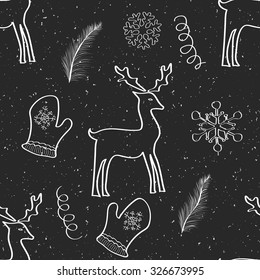 White chalk on a dark grunge board hand drawn seamless pattern with deer, snowflakes, mittens and feathers. Christmas and New Year background for decoration, wallpaper and print. Eps10  