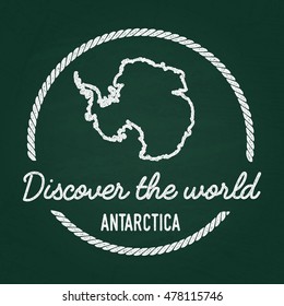 White chalk texture hipster insignia with Antarctica map on a green blackboard. Grunge rubber seal with country outlines, vector illustration.