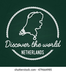 White chalk texture hipster insignia with Kingdom of the Netherlands map on a green blackboard. Grunge rubber seal with country outlines, vector illustration.