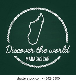 White chalk texture hipster insignia with Republic of Madagascar map on a green blackboard. Grunge rubber seal with country outlines, vector illustration.