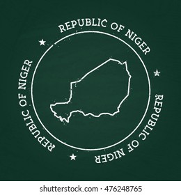 White chalk texture rubber seal with Republic of Niger map on a green blackboard. Grunge rubber seal with country outlines, vector illustration.