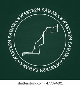 White chalk texture rubber seal with Western Sahara map on a green blackboard. Grunge rubber seal with country outlines, vector illustration.