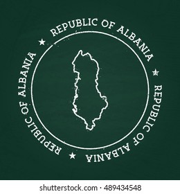 White chalk texture rubber seal with Republic of Albania map on a green blackboard. Grunge rubber seal with country outlines, vector illustration.