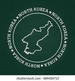 White chalk texture rubber seal with Democratic People's Republic of Korea map on a green blackboard. Grunge rubber seal with country outlines, vector illustration.
