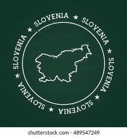 White chalk texture rubber seal with Republic of Slovenia map on a green blackboard. Grunge rubber seal with country outlines, vector illustration.
