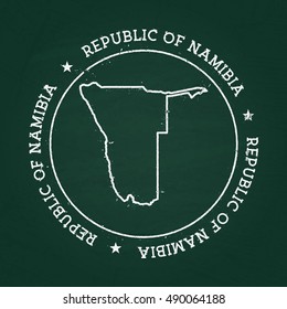 White chalk texture rubber seal with Republic of Namibia map on a green blackboard. Grunge rubber seal with country outlines, vector illustration.