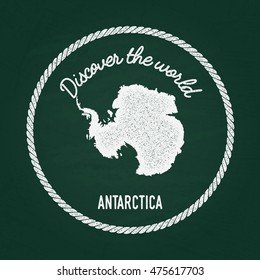 White chalk texture vintage insignia with Antarctica map on a green blackboard. Grunge rubber seal with country outlines, vector illustration.