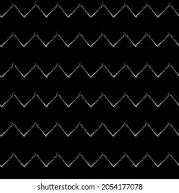 White chalk zigzag on a black background