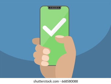 White checkmark on green touchscreen. Hand holding bezel free / frameless smartphone. Mobile success concept. Modern design for web banners, web sites, infographics.