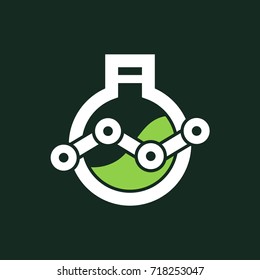 White chemical flask with a green liquid inside on dark background 