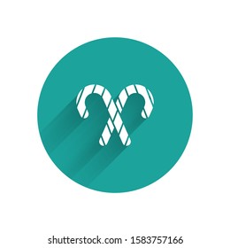 White Christmas candy cane with stripes icon isolated with long shadow. Merry Christmas and Happy New Year. Green circle button. Vector Illustration