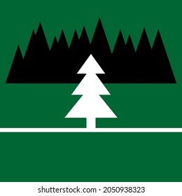White Christmas tree in front of black forest with green background
