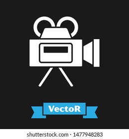 White Cinema camera icon isolated on black background. Video camera. Movie sign. Film projector.  Vector Illustration