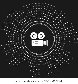 White Cinema camera icon isolated on grey background. Video camera. Movie sign. Film projector. Abstract circle random dots. Vector Illustration