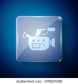 White Cinema camera icon isolated on blue background. Video camera. Movie sign. Film projector. Square glass panels. Vector Illustration