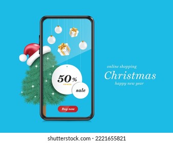 White circle promotion tag label with text 50% off tied with rope and hanging from smartphone with ball,gift box and beside it was christmas tree and santa hat draped over it for online shopping