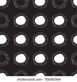White circles on a black background, abstract modern texture, seamless pattern. Freehand drawing  monochrome  vector design.
