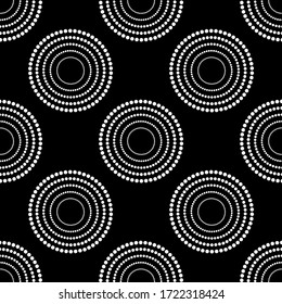 White circles pattern on black seamless background.