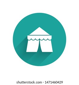 White Circus tent icon isolated with long shadow. Carnival camping tent. Amusement park. Green circle button. Vector Illustration