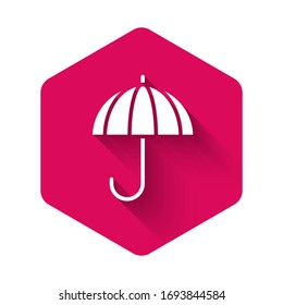 White Classic elegant opened umbrella icon isolated with long shadow. Rain protection symbol. Pink hexagon button. Vector Illustration