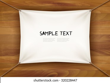 White cloth banner with text space on wooden background. Vector
