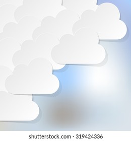 White Clouds in the corner on a light blue bokeh fog background.