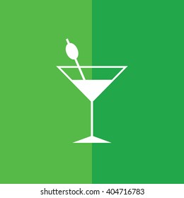 White cocktail glass icon vector illustration. Green background