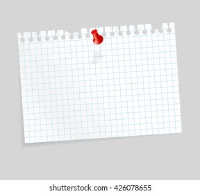 white colored checkered scrap of paper with pin needle