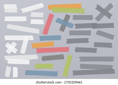 White and colorful different size adhesive, sticky, masking, duct tape, paper pieces are on grey background
