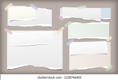 White and colorful note, notebook paper strips with torn edges stuck with sticky tape on brown background. Vector illustration.