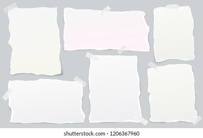 White and colorful ripped strips, note, notebook paper for text or message stuck with sticky tape on gray background