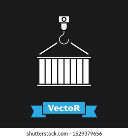 White Container on crane icon isolated on black background. Crane lifts a container with cargo.  Vector Illustration