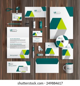 White corporate identity template design with green geometric elements. Business stationery