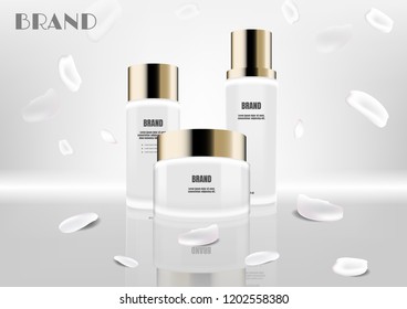 White cosmetic set with falling petals on grey screen