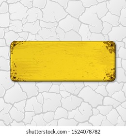 White cracked background with old grunge yellow nameplate