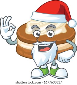 White cream alfajor cartoon character of Santa showing ok finger