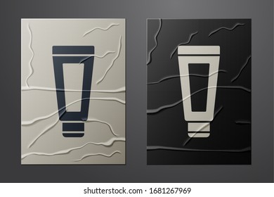 White Cream or lotion cosmetic tube icon isolated on crumpled paper background. Body care products for men. Paper art style. Vector Illustration