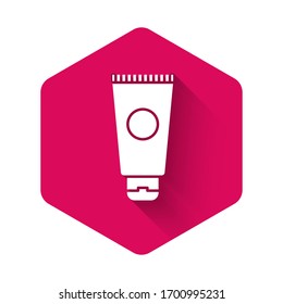 White Cream or lotion cosmetic tube icon isolated with long shadow. Body care products for men. Pink hexagon button. Vector Illustration