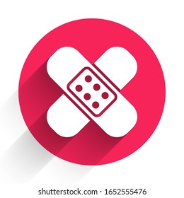 White Crossed bandage plaster icon isolated with long shadow. Medical plaster, adhesive bandage, flexible fabric bandage. Red circle button. Vector Illustration