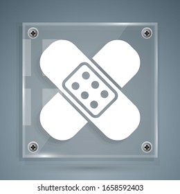 White Crossed bandage plaster icon isolated on grey background. Medical plaster, adhesive bandage, flexible fabric bandage. Square glass panels. Vector Illustration
