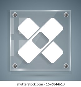 White Crossed bandage plaster icon isolated on grey background. Medical plaster, adhesive bandage, flexible fabric bandage. Square glass panels. Vector Illustration