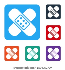 White Crossed bandage plaster icon isolated on white background. Medical plaster, adhesive bandage, flexible fabric bandage. Set icons in color square buttons. Vector Illustration