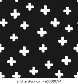White crosses isolated on a black background. Drawn by hand with a rough brush. Grunge, sketch, paint, ink, graffiti. Vector illustration.