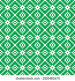 White cross-stitch knitting pattern on green background. White square dots on green backdrop. Monochrome fabric pattern design for sale. Knitting handicraft art.