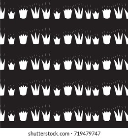 white crowns of different shapes on a black background.crowns drawn in a naive style, children's drawing. seamless pattern.Freehand drawing vector.
