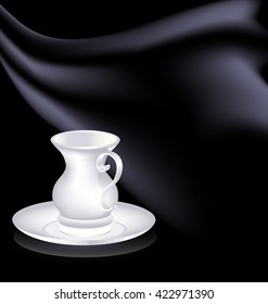 white cup and black drape