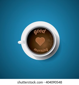 white cup of coffee with heart and text - good morning . flat lay coffee mug top view on blue background