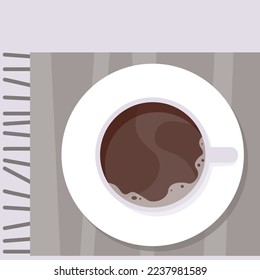 Weiße Tasse Kaffee auf einem kargeplaid