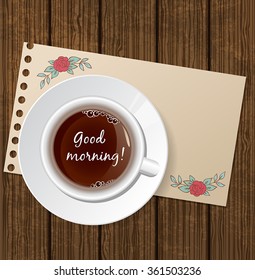 White cup of coffee on a wooden background
