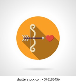 White Cupid bow and arrow  shot a red heart. Love at first sight. Love symbol. Yellow round vector icon, long shadow. Element for web design, business, mobile app.